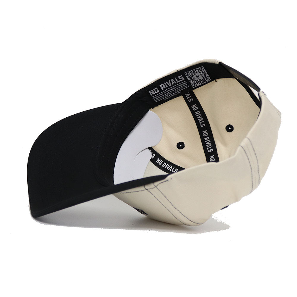 The Appalachian State Vintage Hat by No Rivals is a beige and black snapback shown from above, revealing the inner band repeatedly printed with "NO RIVALS." It features a structured fit and is made from high-quality cotton.