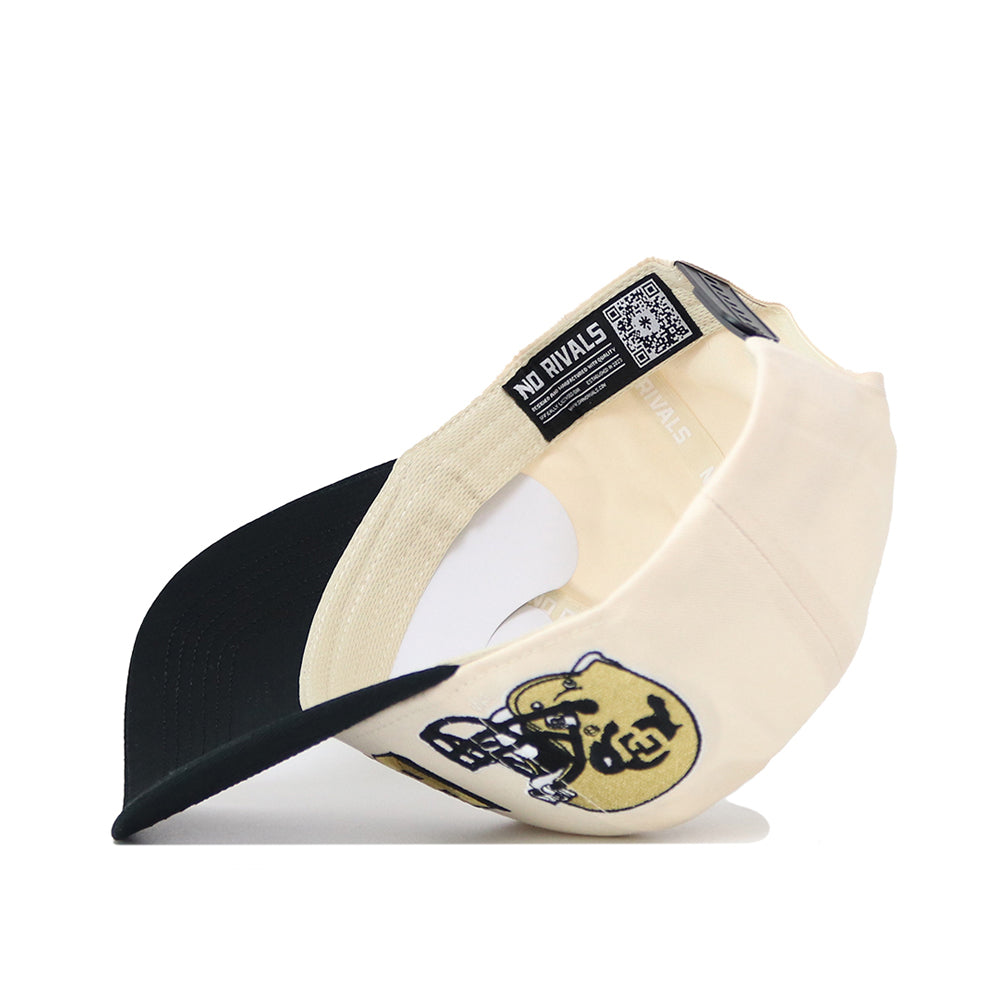The Colorado Alma Mater Hat, a cream snapback, is turned sideways to display its black under-brim, an embroidered football helmet with "1969," and a NO RIVALS label featuring a QR code inside the structured fit.