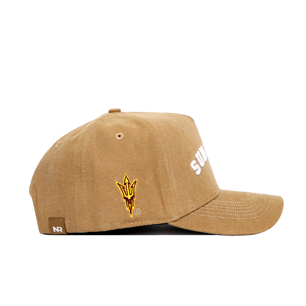 The Arizona State Rustic Hat by No Rivals is a tan snapback with "SUN DEVILS" in white on the front and a yellow-red trident logo on the side. Made from quality cotton, this officially licensed cap features an NR label near the back.