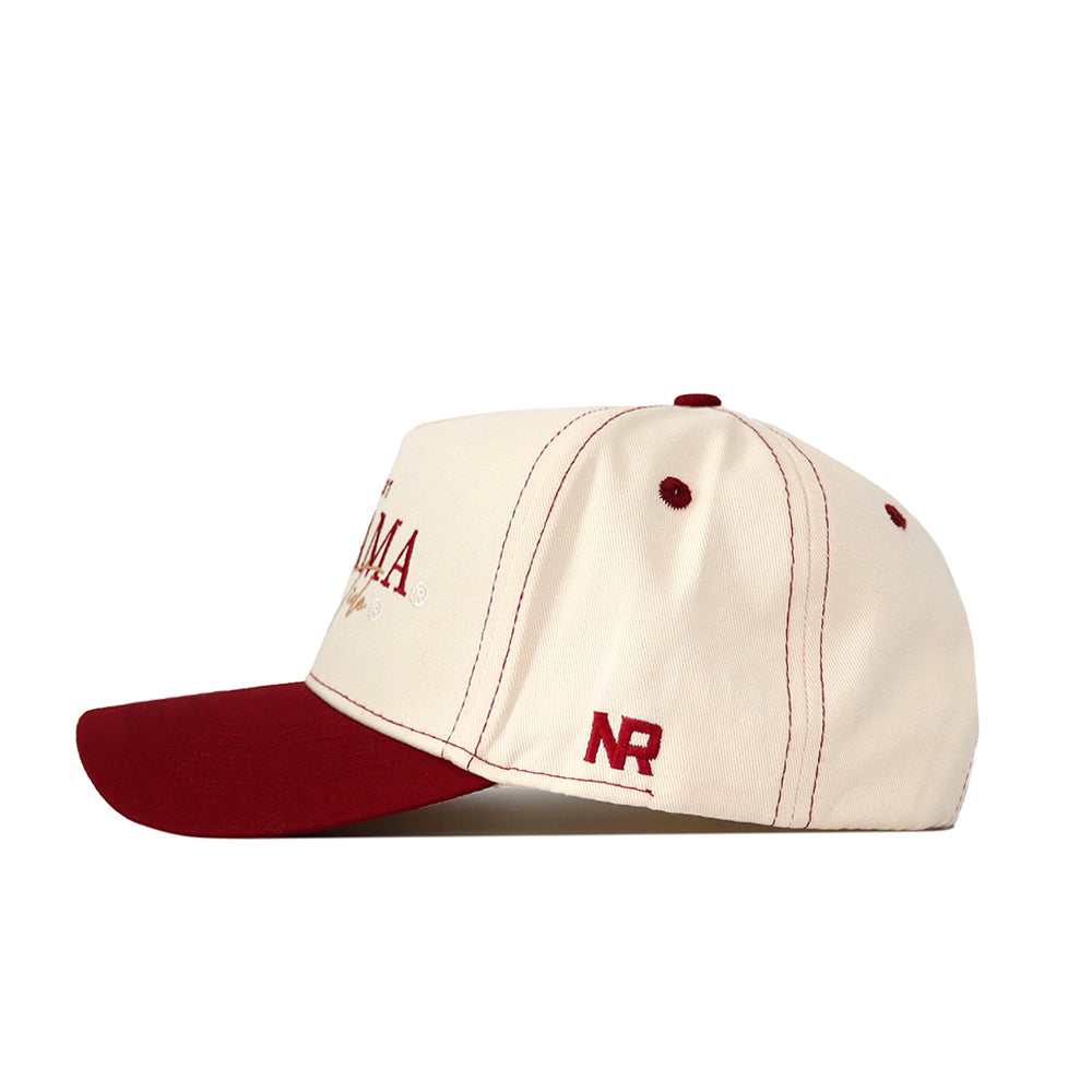 The No Rivals Alabama Vintage Hat features a cream-colored snapback design with a maroon brim, button, and stitching. Made from high-quality cotton for comfort and durability, it displays maroon "NR" embroidery on the side near the back.