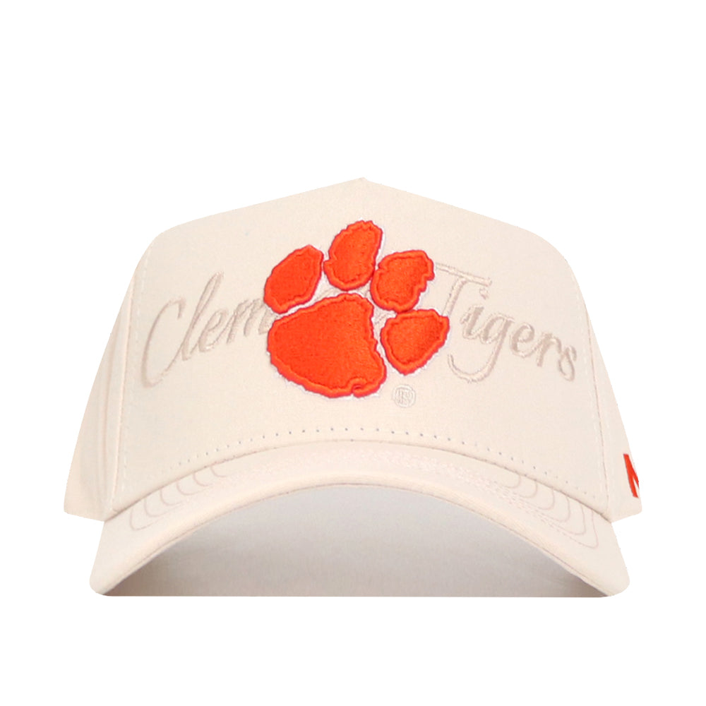 The No Rivals Clemson Stacked Hat is a beige structured snapback featuring an orange tiger paw print and "Clemson Tigers" in cursive embroidered behind the paw.