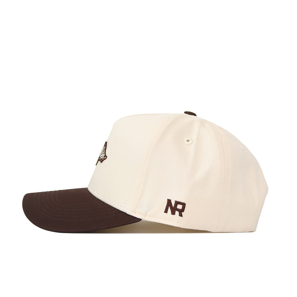 The Arkansas Espresso Hat by No Rivals features a cream crown, dark brown brim, and high-quality cotton construction with "NR" embroidered in brown on the side.