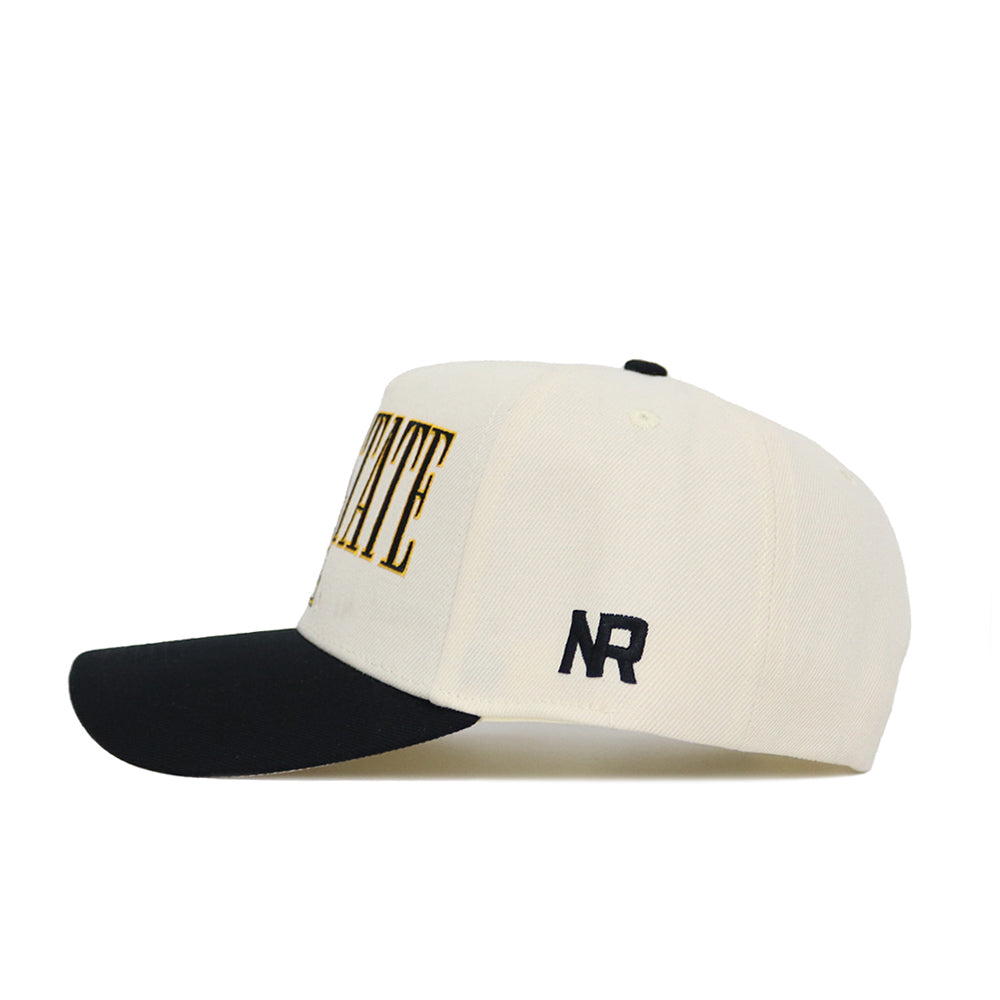 The App State Retro Block Hat by No Rivals is a structured snapback with a white crown, black brim, bold black and gold front lettering, and "NR" initials embroidered in black on the side.