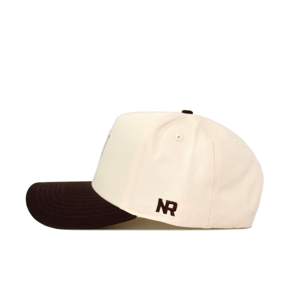 The No Rivals Arizona State Espresso Hat is a cream baseball cap with a dark brown bill, made of high-quality cotton. It features “NR” embroidered in brown on the side near the back and is shown in profile.
