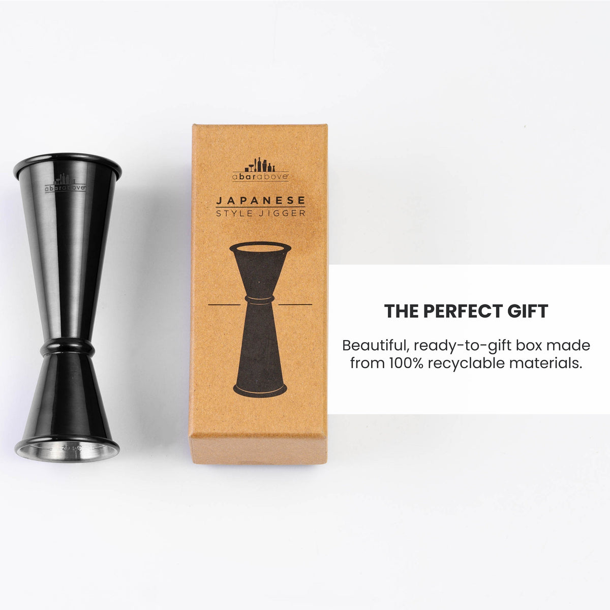 An infographic showing a gunmetal Japanese-style jigger alongside its recyclable brown gift box, highlighting its gifting features (details in description).