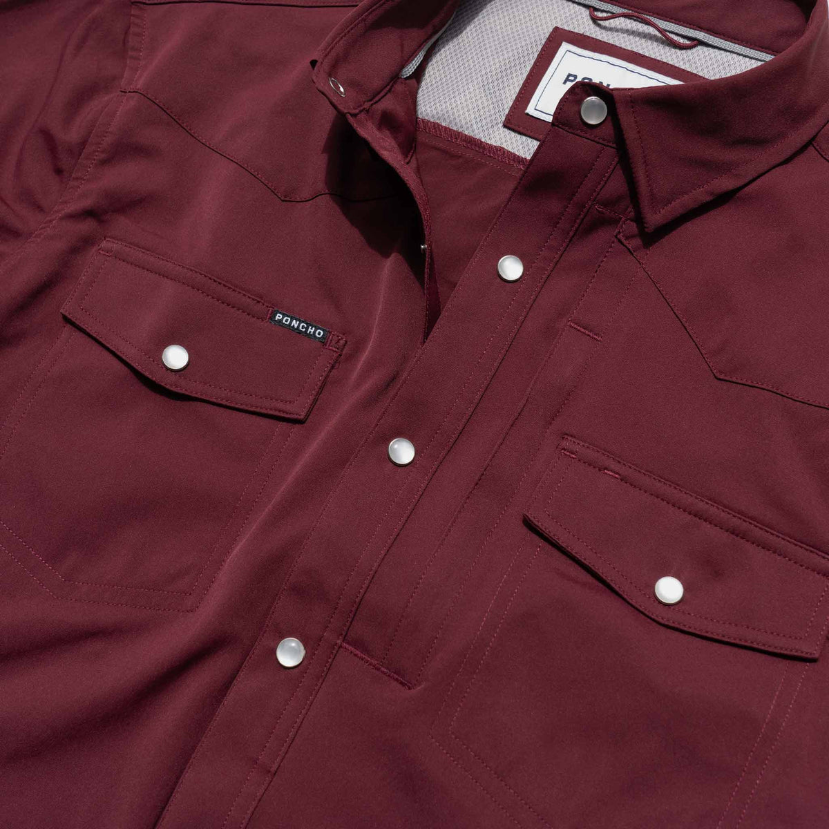 close up of maroon short sleeve pearl snap shirt