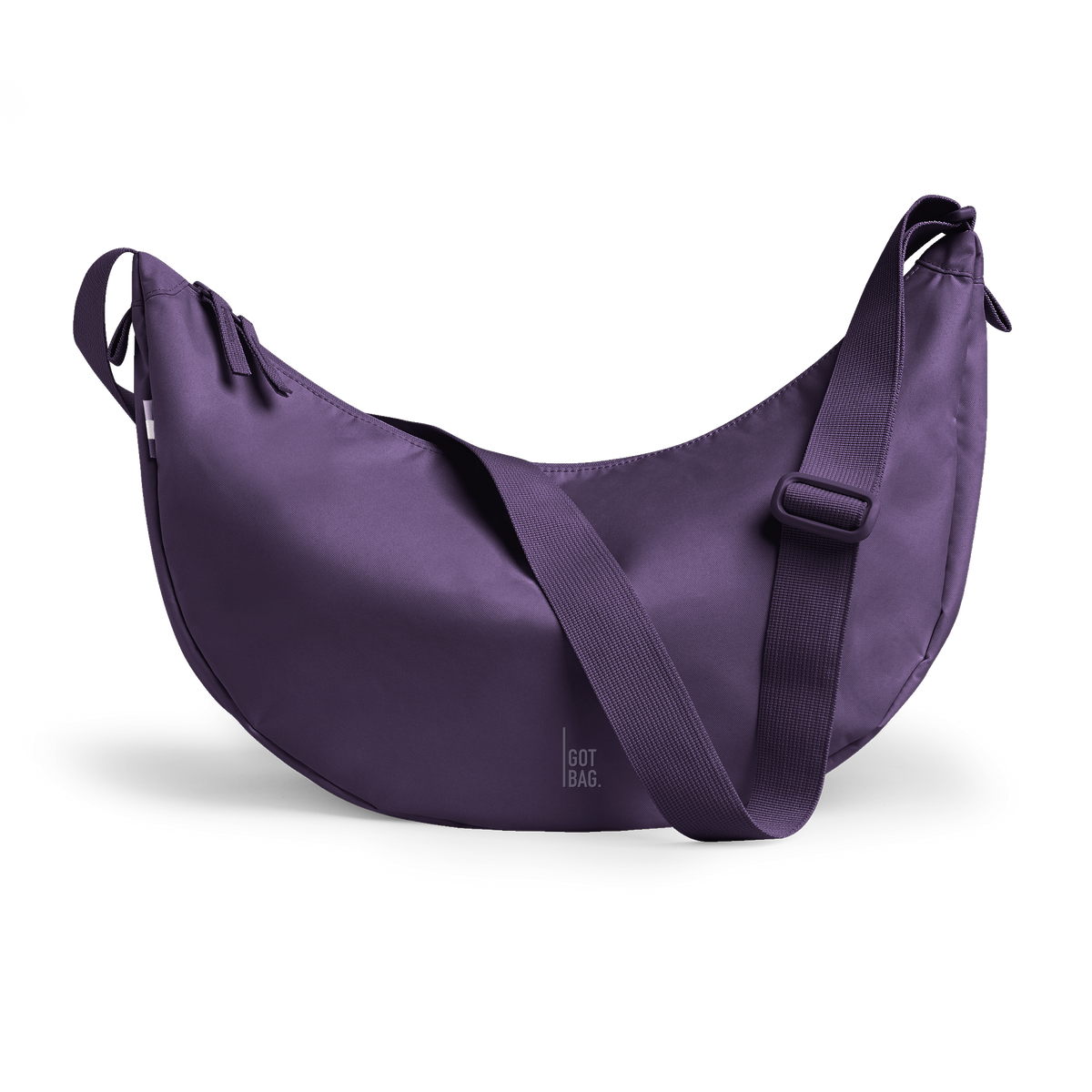MOON BAG LARGE bag in ocean dusk (Bold Dark Purple), studio shot, front view.