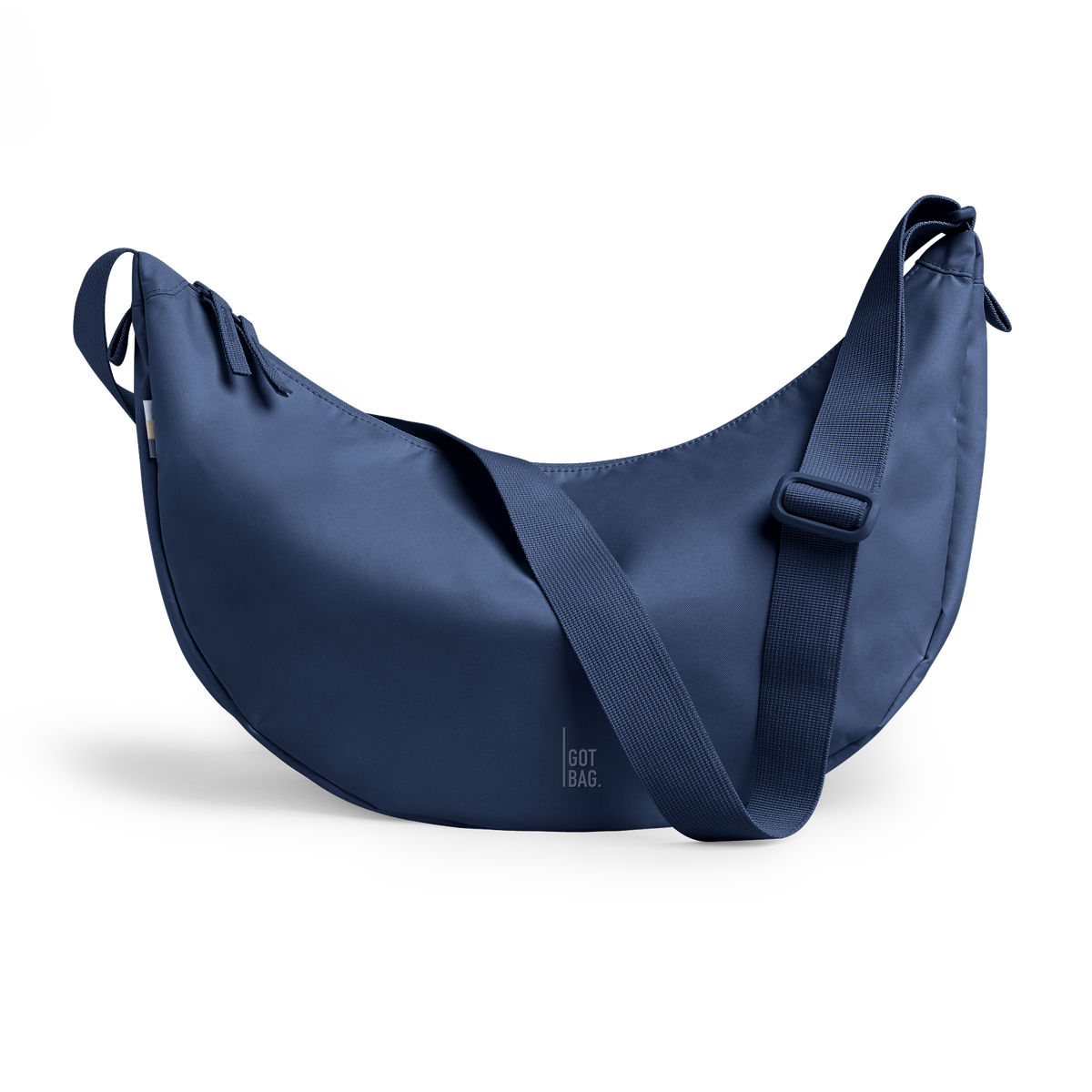 MOON BAG LARGE bag in deep ocean (Dark Navy Blue), studio shot, front view.