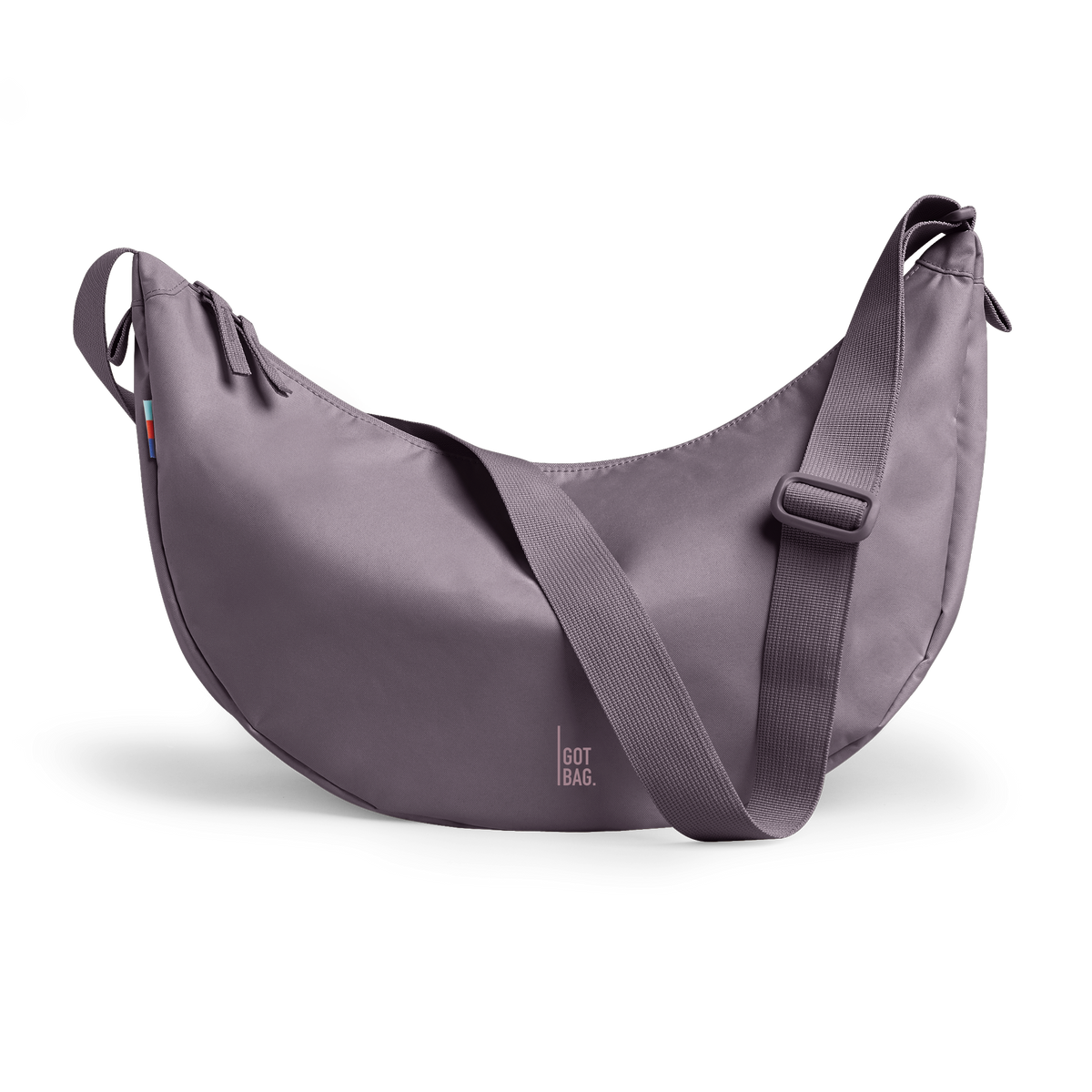 MOON BAG LARGE bag in sea urchin (Muted Purple with a Gray Undertone / Lavender), studio shot, front view.