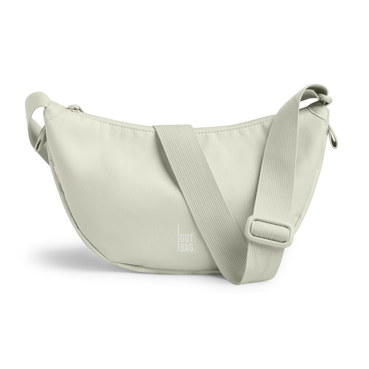 MOON BAG SMALL Monochrome Edition bag in beach foam (Light Gray), studio shot, front view.