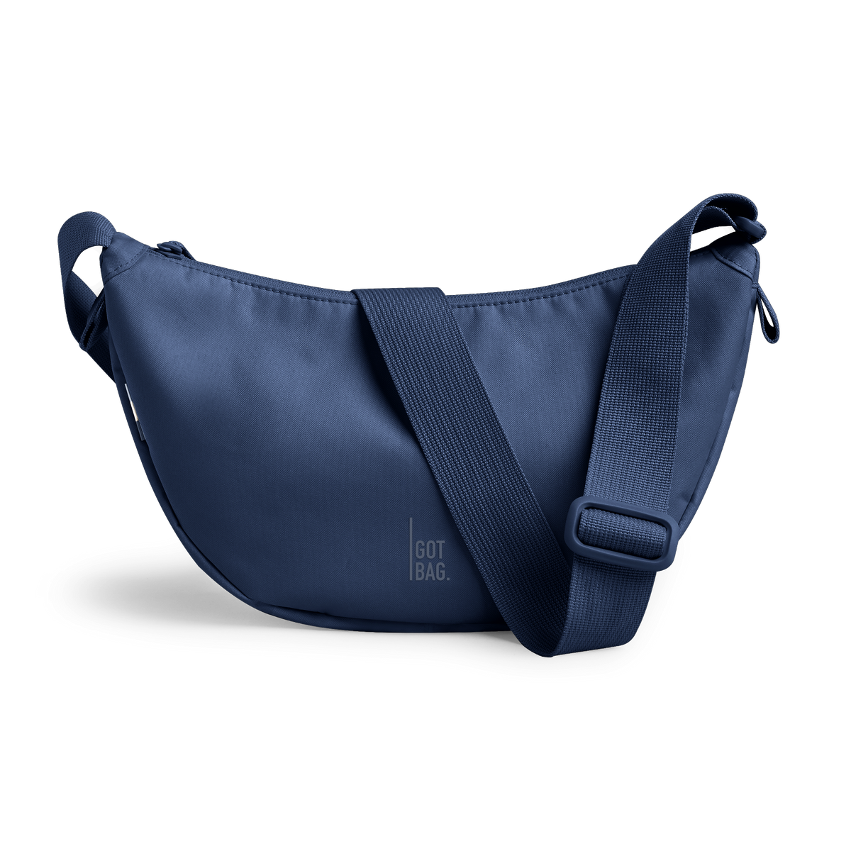 MOON BAG SMALL bag in dark ocean (Dark Navy Blue), studio shot, front view.
