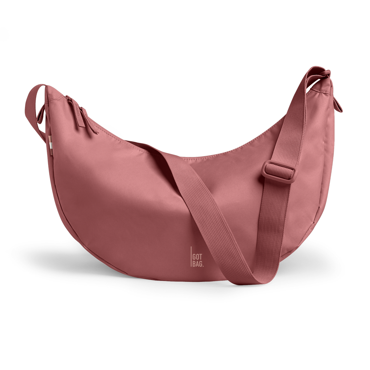 MOON BAG bag in lionfish (Dark Pink with a Red Undertone), studio shot, front view.
