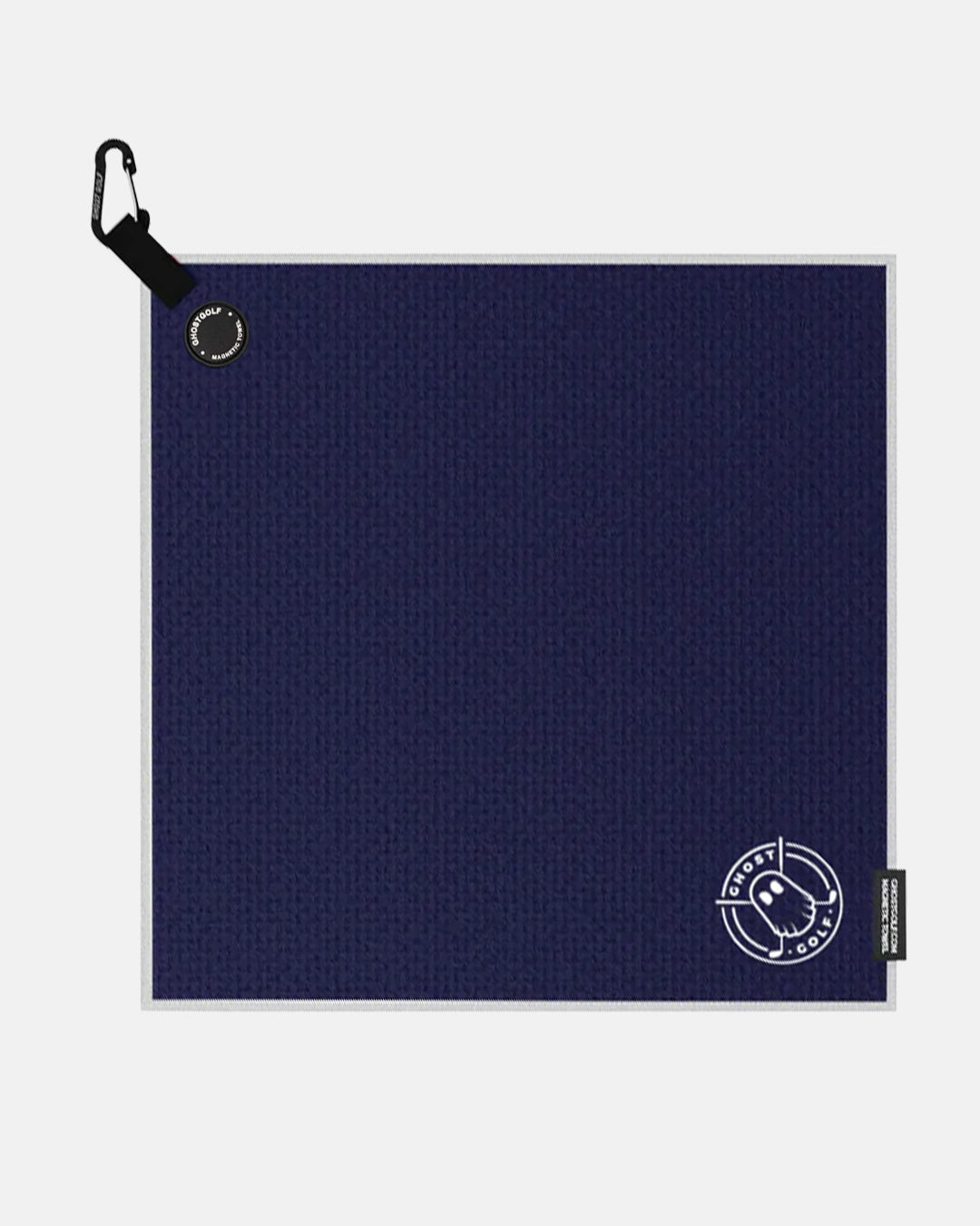 Product shot of Navy Ghost Golf Magnetic Greenside Towel with emblem logo near the bottom and carabiner clip at the top #color_navy