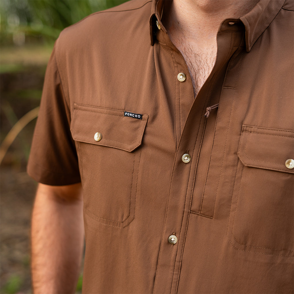 Man wearng short sleeve brown shirt