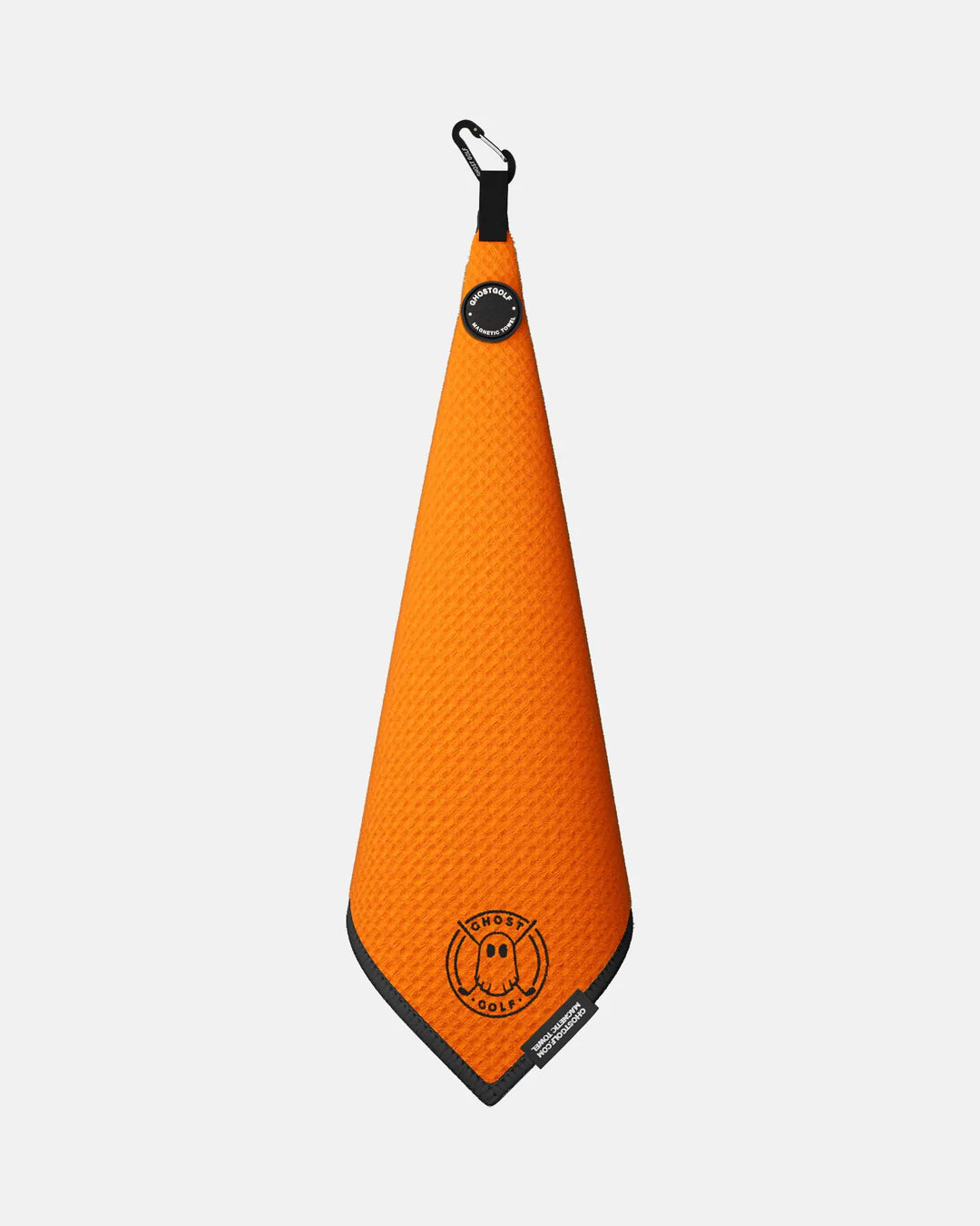 Product shot of Orange Ghost Golf Magnetic Greenside Towel with emblem logo near the bottom and carabiner clip at the top #color_orange