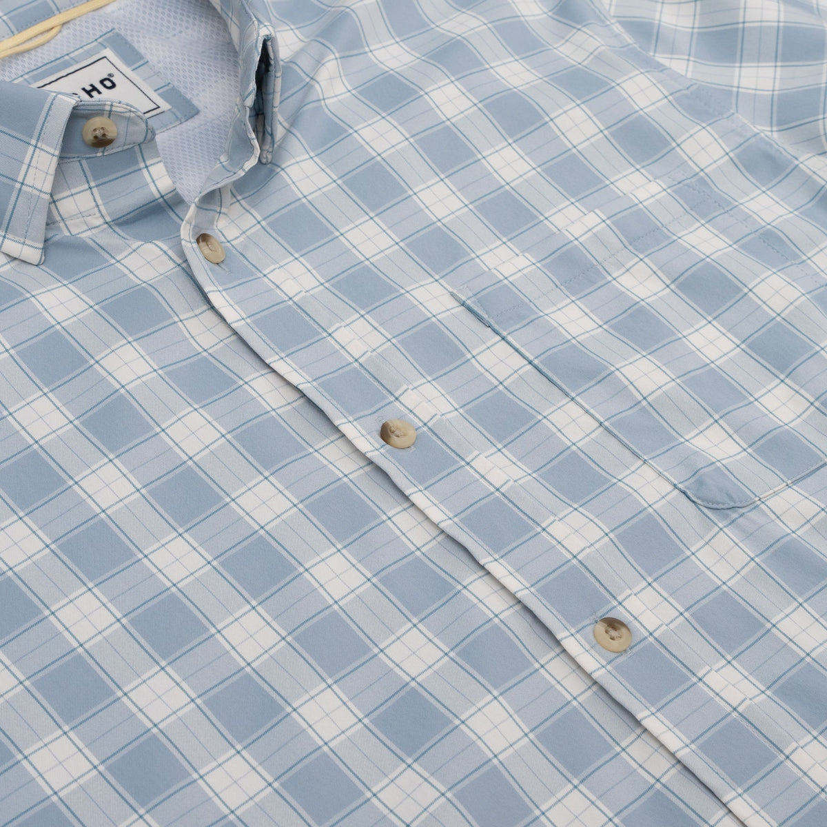 Close up photo of blue plaid chest pocket