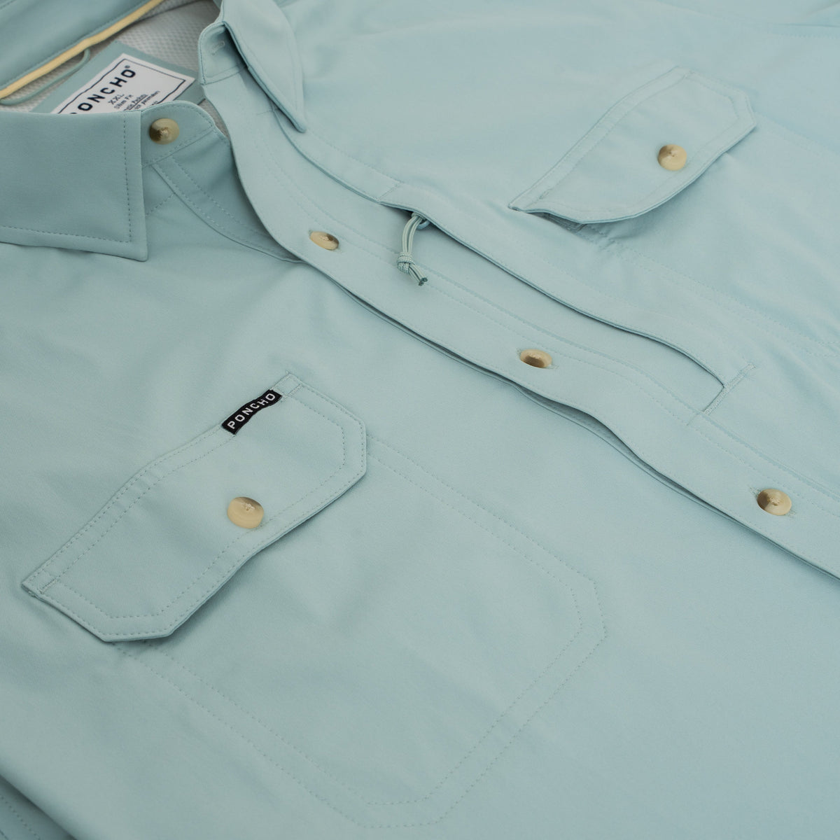 Light blue comfortable outdoor shirt close-up featuring The Antilles styling details
