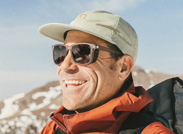 RICH guy smiling wearing sunski couloir sunglasses