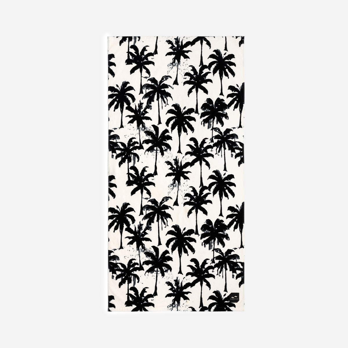 Velour towel with black palm tree silhouettes on white background.