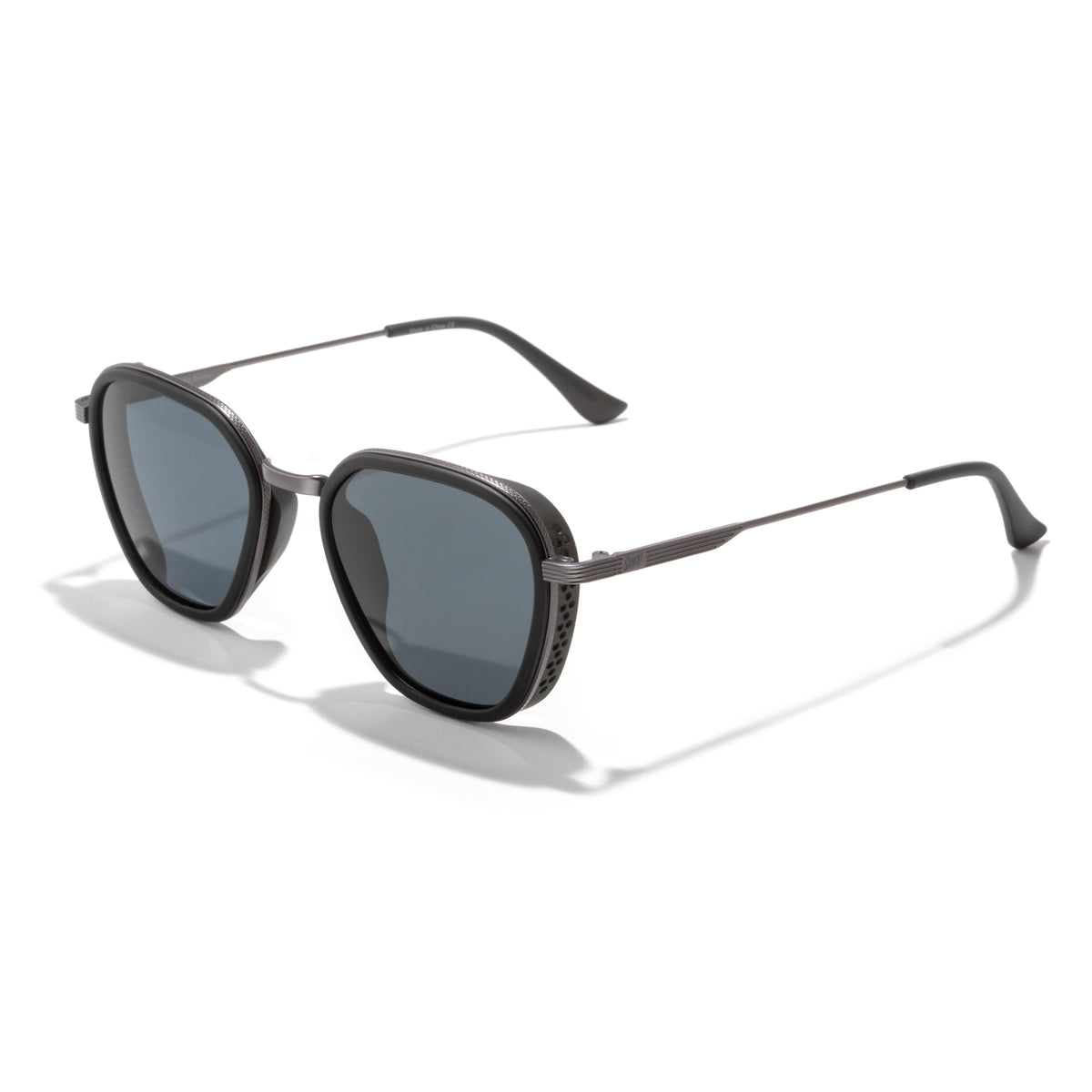 Sunglasses with dark lenses and thin metal frame on a white background