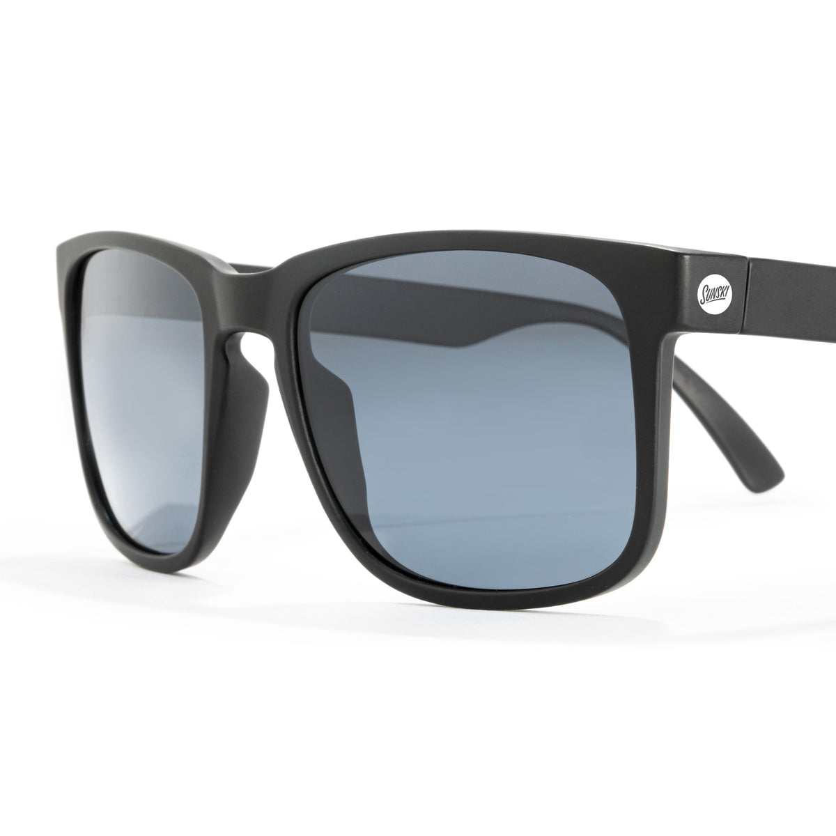 Black sunglasses with gray lenses on a white background