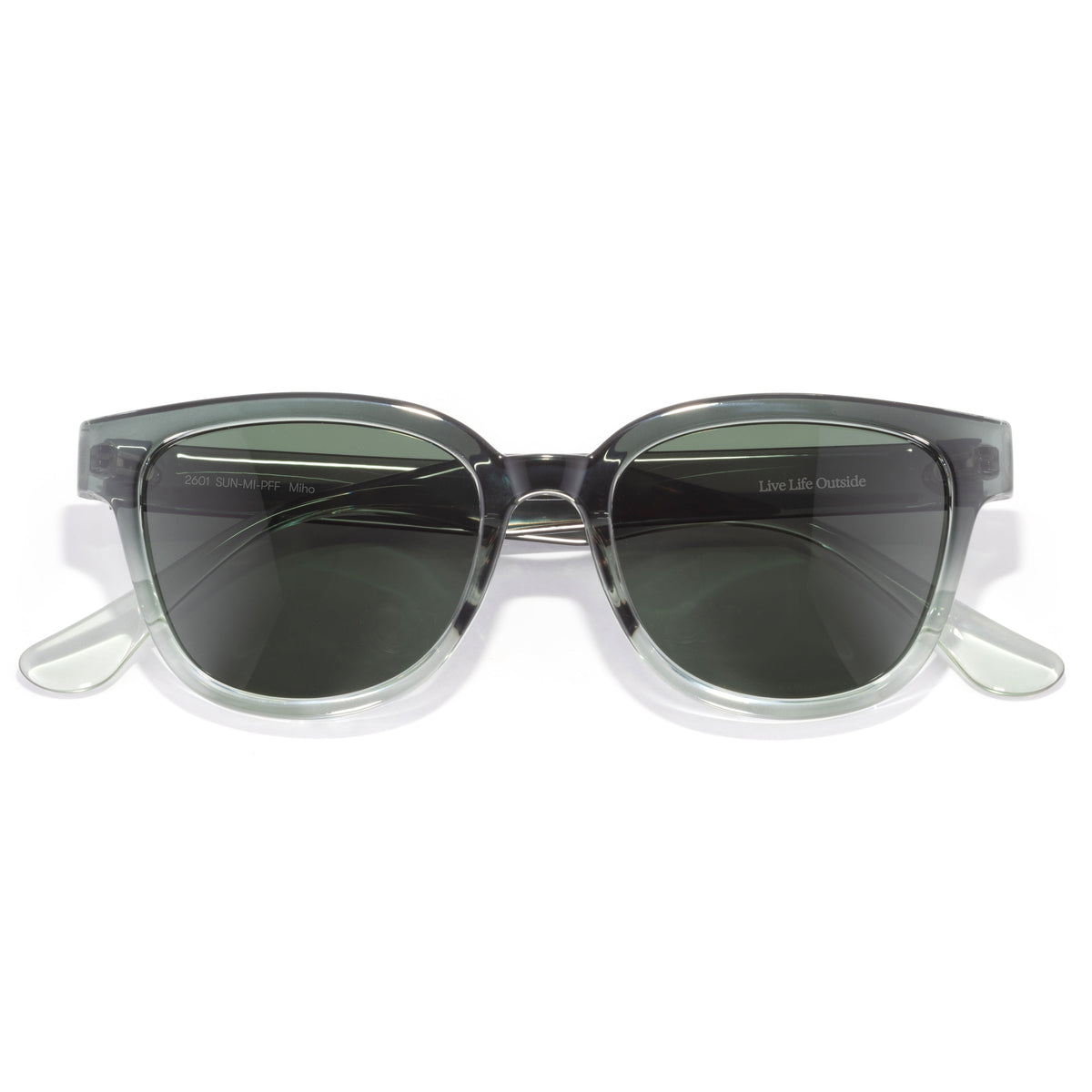Sunglasses with clear frame and dark lenses on a white background
