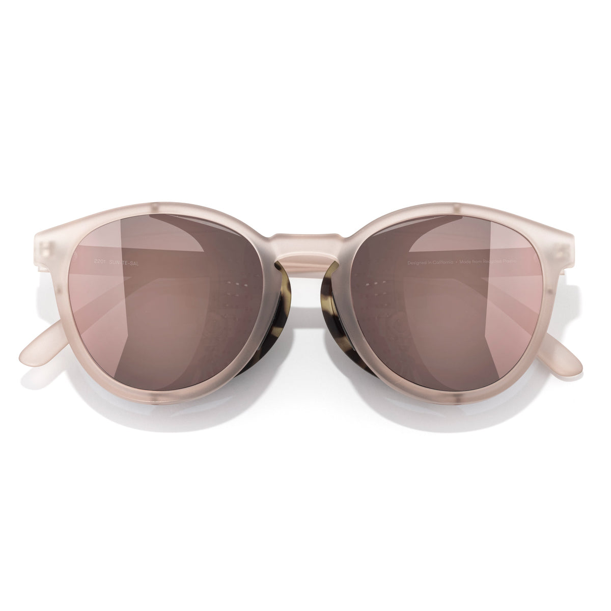 Sunglasses with a beige frame and brown lenses on a white background