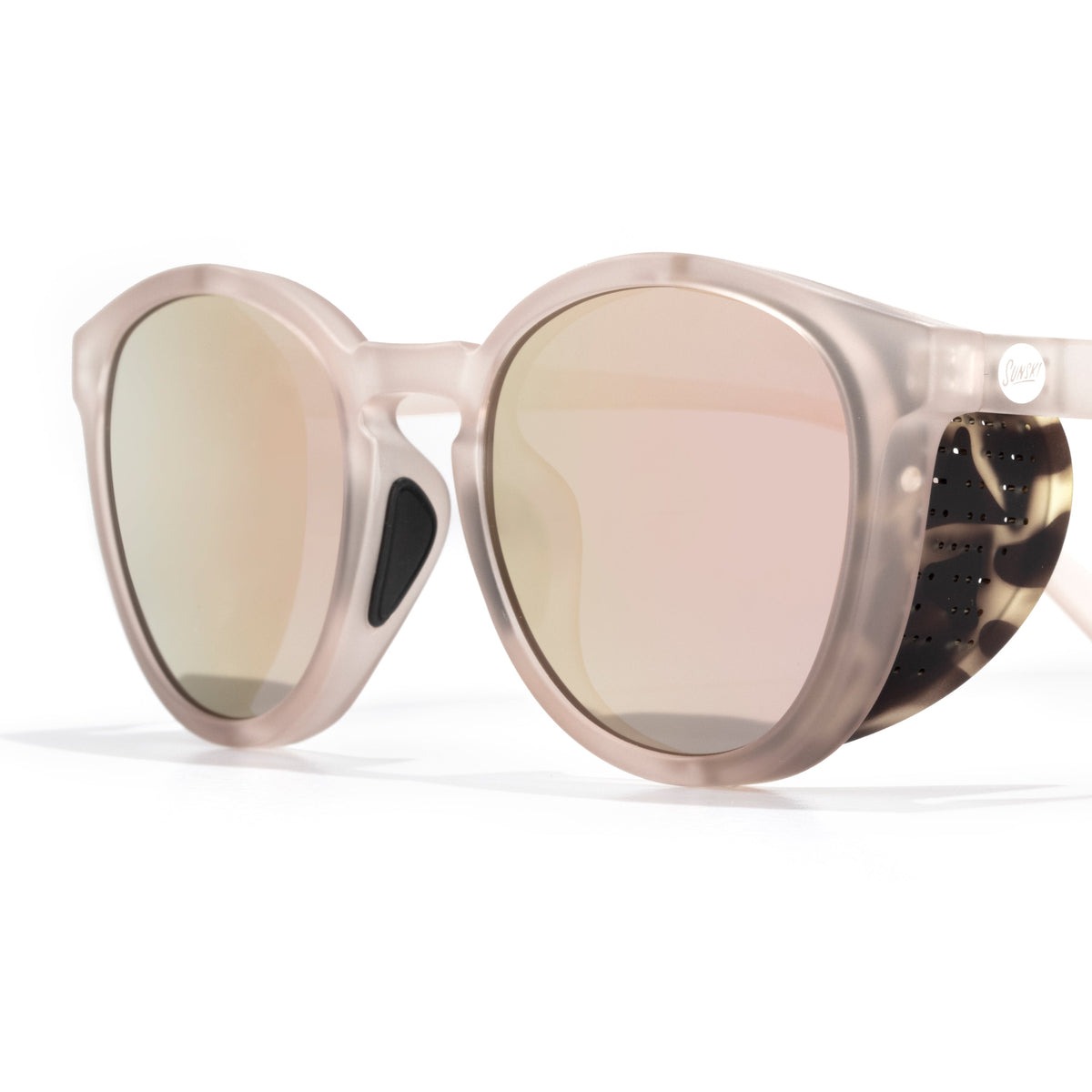 Sunglasses with reflective lenses and a clear frame on a white background