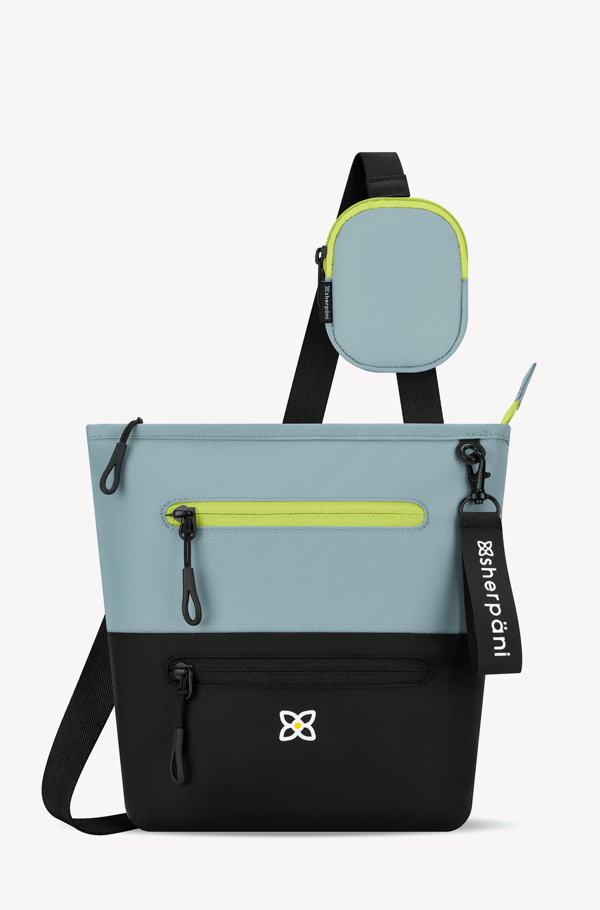 Flat front view of Sherpani&#39;s crossbody, the Sadie in St. Lucia. The top half of the bag is aqua blue accented by a light green trim and the bottom half of the bag is black. It features two exterior zipper pockets on the front panel with easy-pull zippers. A Sherpani branded keychain is attached to a fabric loop in the upper right corner. It has an adjustable crossbody strap. #color_st-lucia