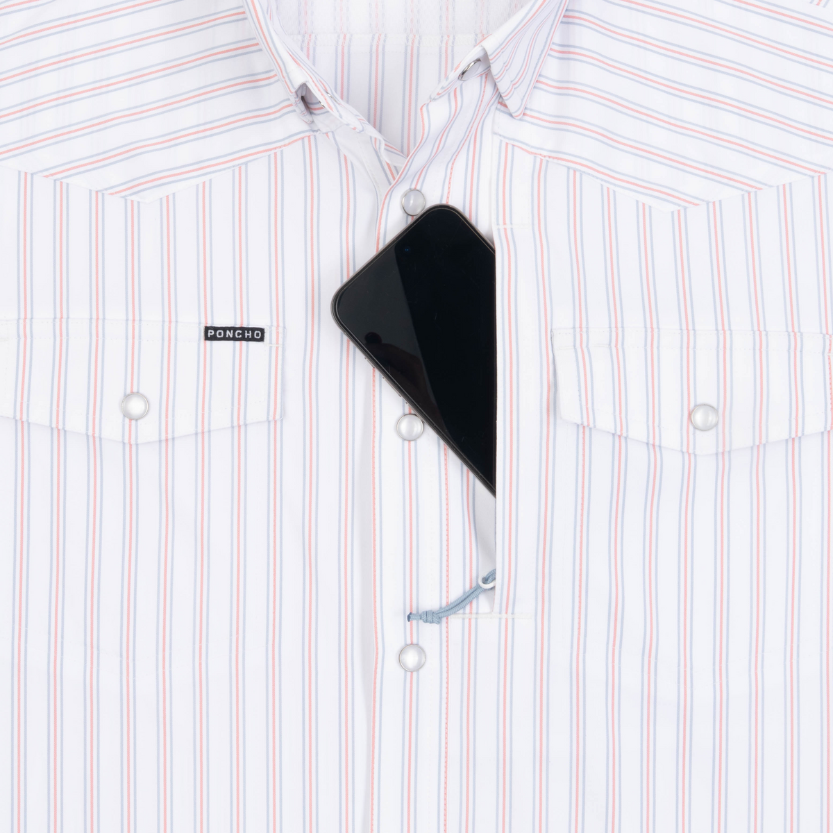 Phone in chest zipper pocket of shirt