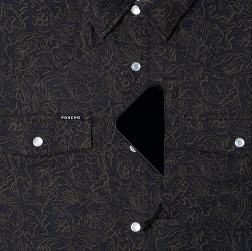 phone in chest zipper pocket of shirt