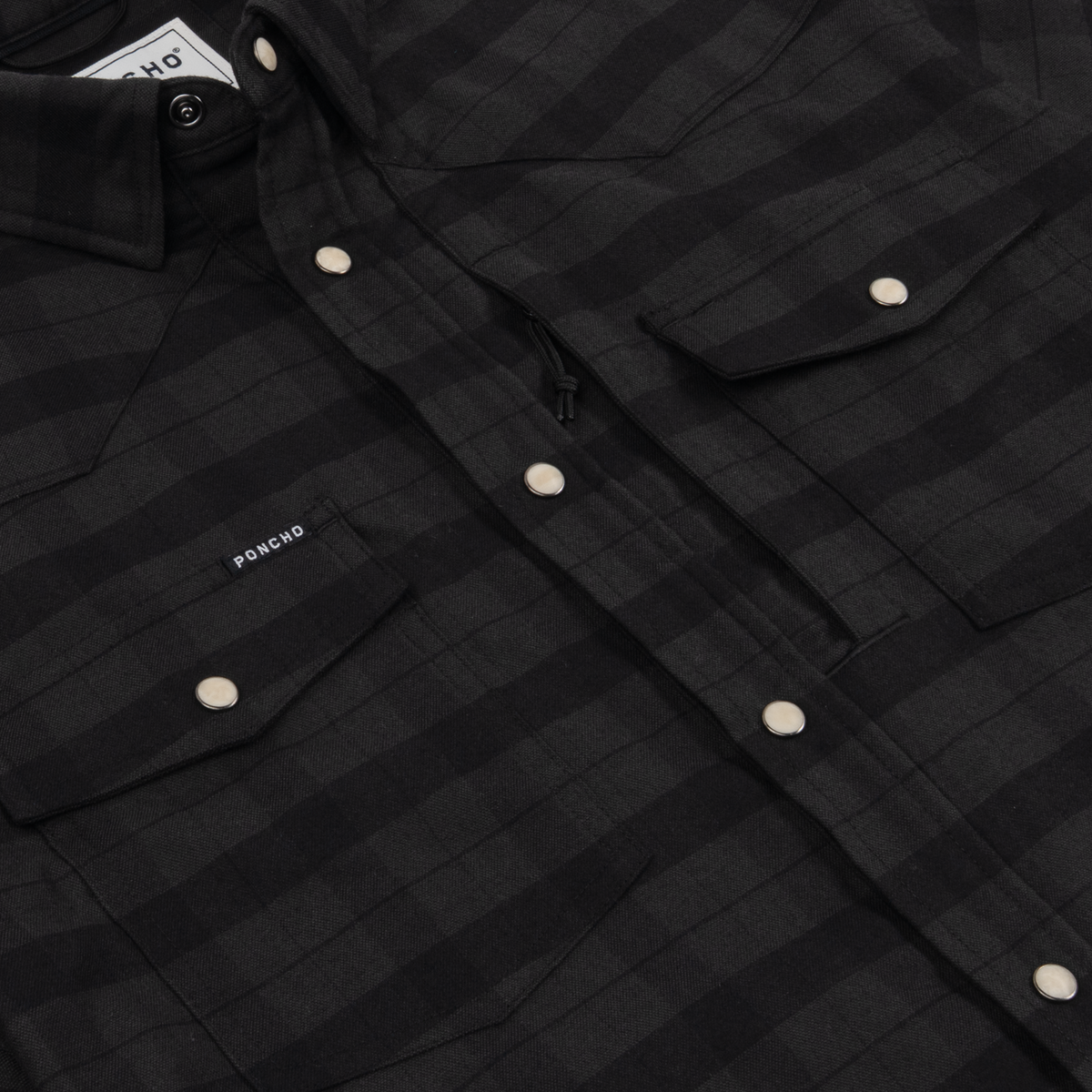 The North Rim dark charcoal plaid western shirt with pearl snap closures and chest pockets for outdoor wear