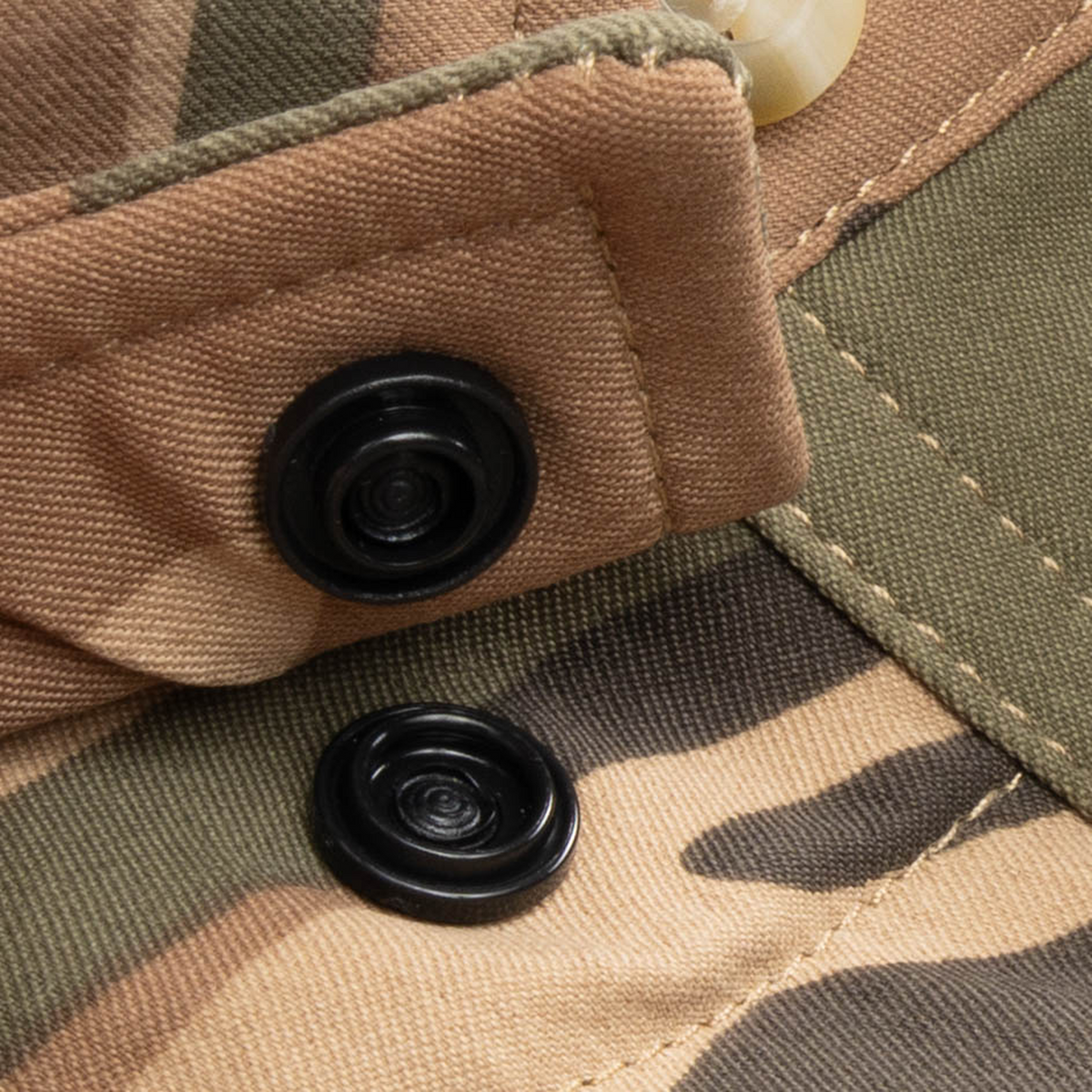 Closeup of collar snaps on collar of shirt