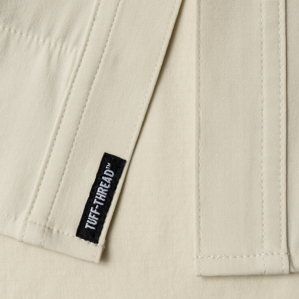 Tuff Threads tag at bottom of shirt