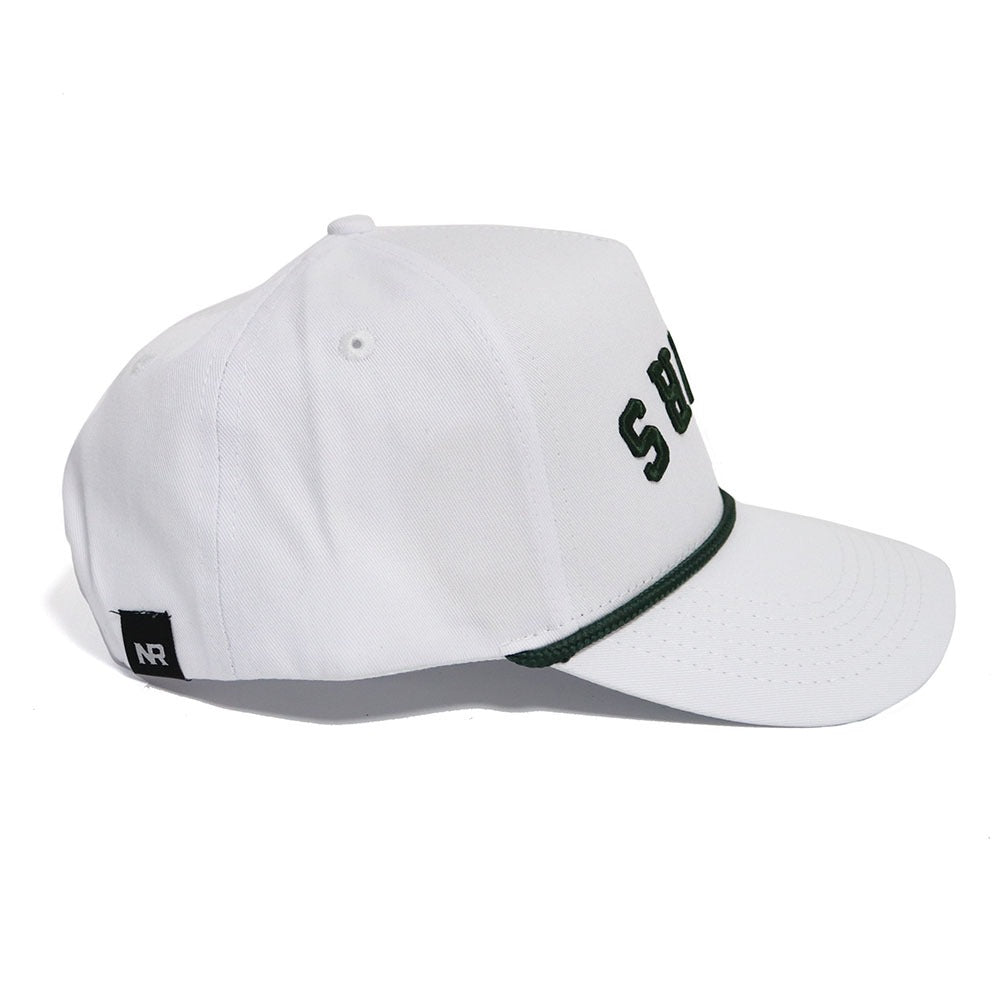 The BEARS Hat - Whiteout by No Rivals is a white cotton baseball cap with dark green trim, partial SB embroidery on the front, a black NR tag near the brim, and a snapback closure for an adjustable fit.