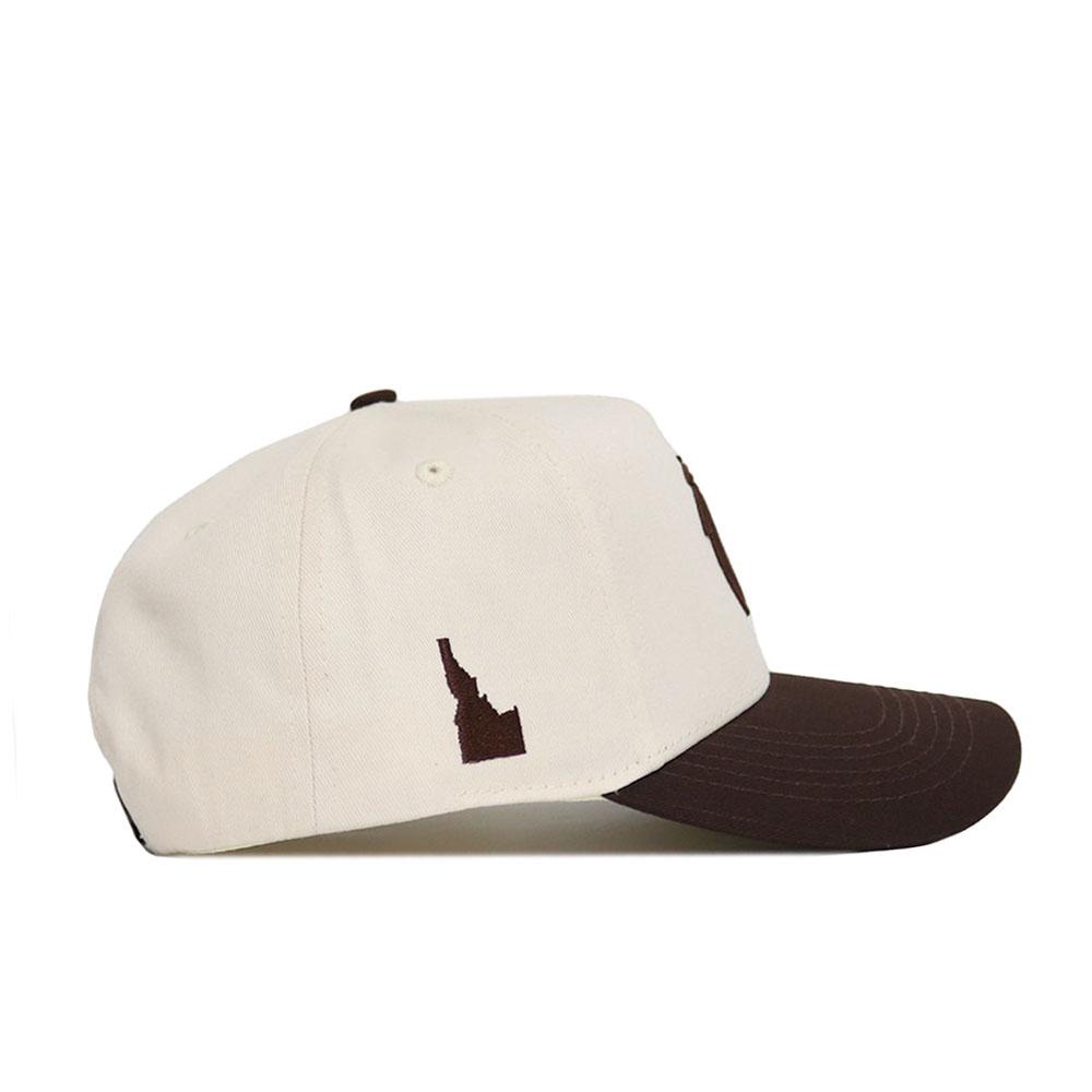 The No Rivals Boise State Espresso Hat features a cream crown, dark brown brim, and a small brown Idaho silhouette. This structured snapback is made from high-quality cotton for lasting comfort and style.