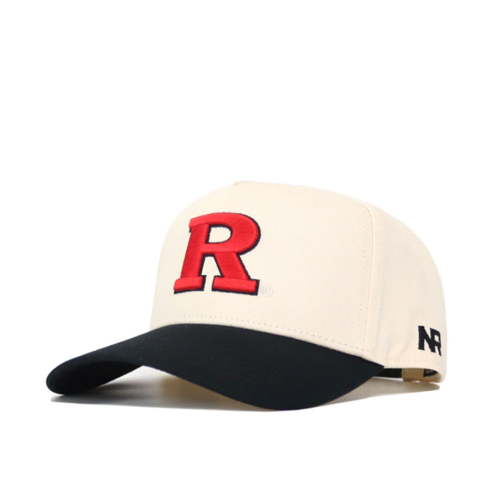 The No Rivals Classic Rutgers Hat (B2B) is a cream cotton cap with a large red R on the front, black curved brim, side black logo, and adjustable snapback strap.