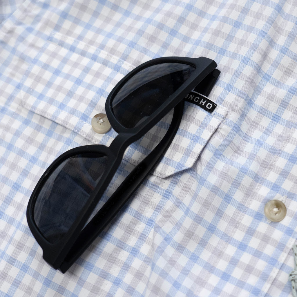 Blue &amp; Grey plaid shirt shirt  sleeve sunglass close up