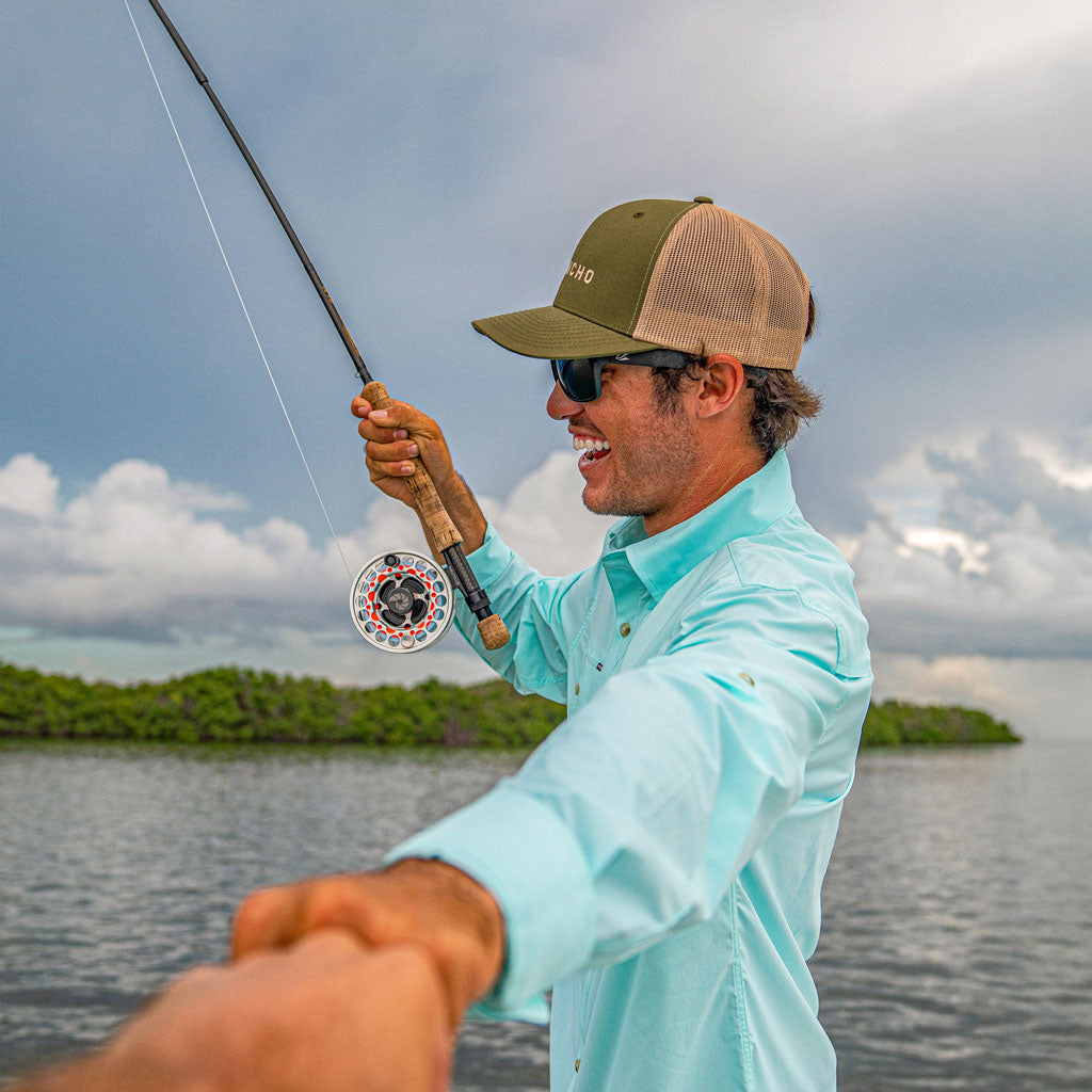 Aqua green shirt long sleeve man fishing 