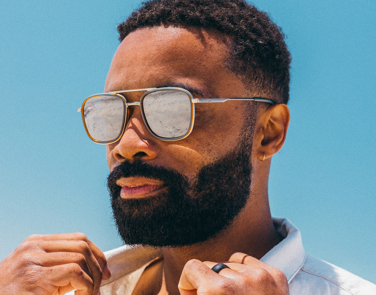STORY guy wearing estero sunglasses blue sky