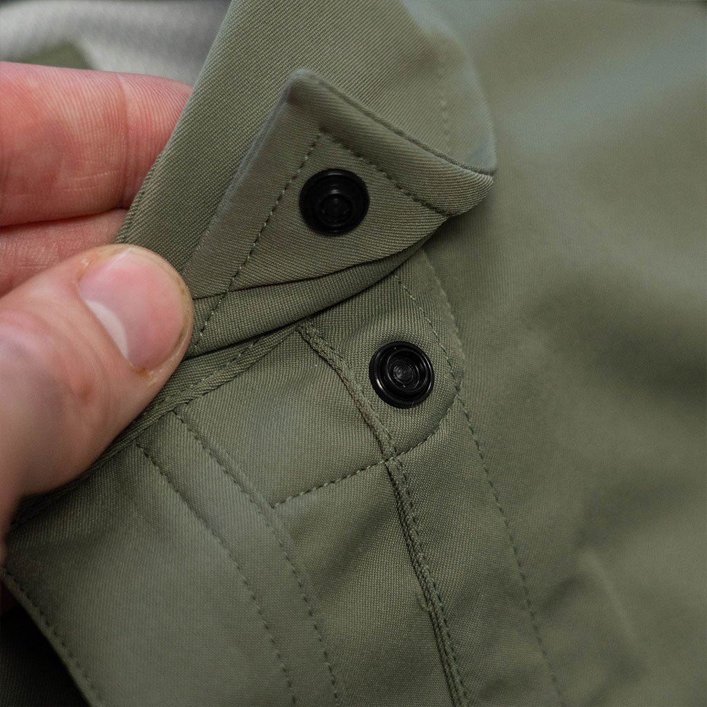 close up of snap buttons on collar