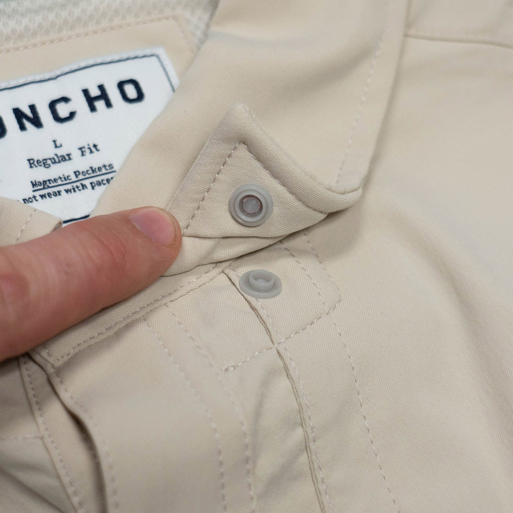 tan shirt collar snap close up