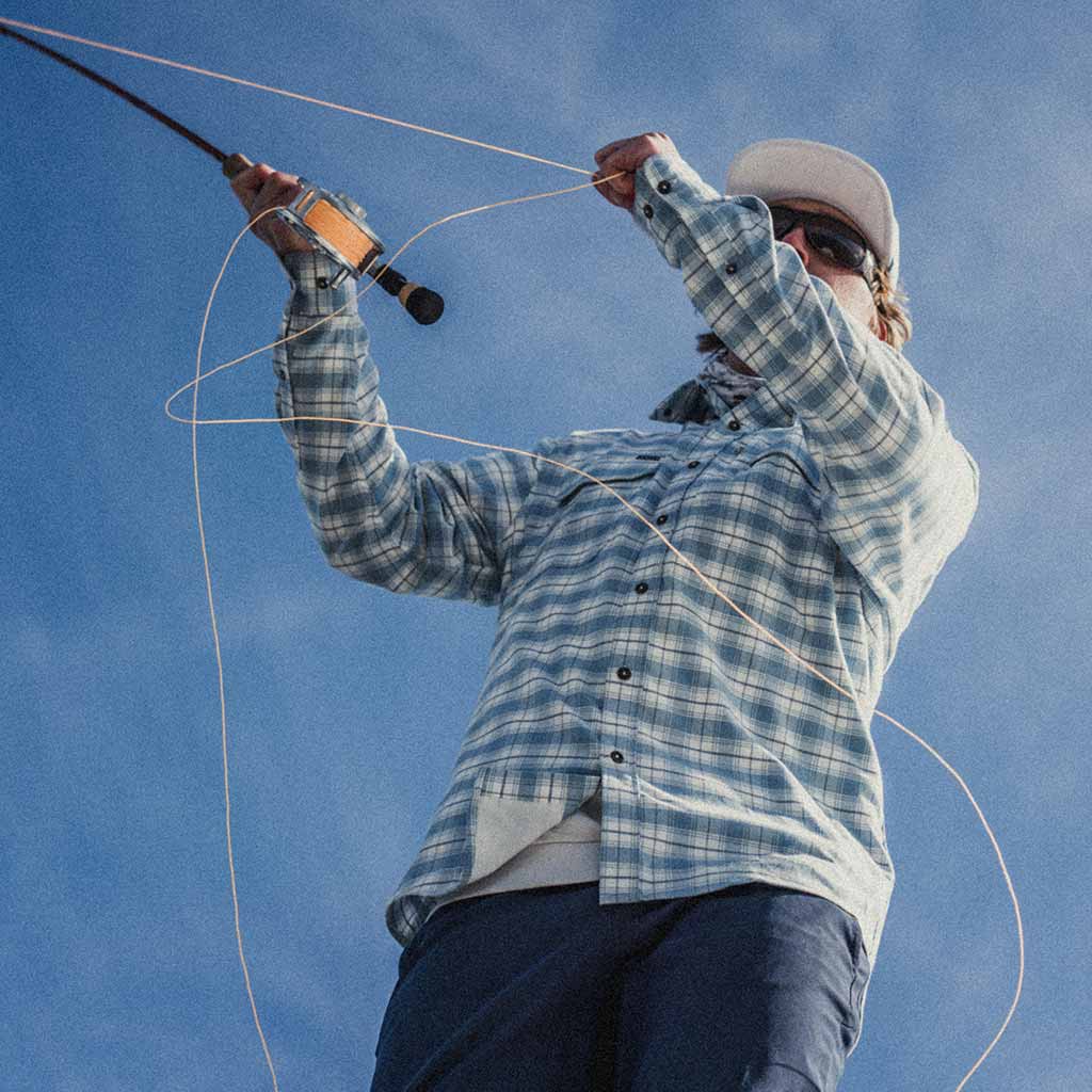 Photo of man fishing in Blue Bison shirt 