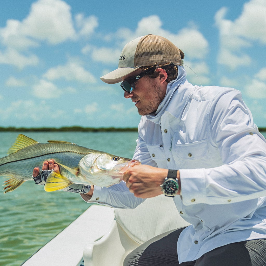 Man in white shirt with fish