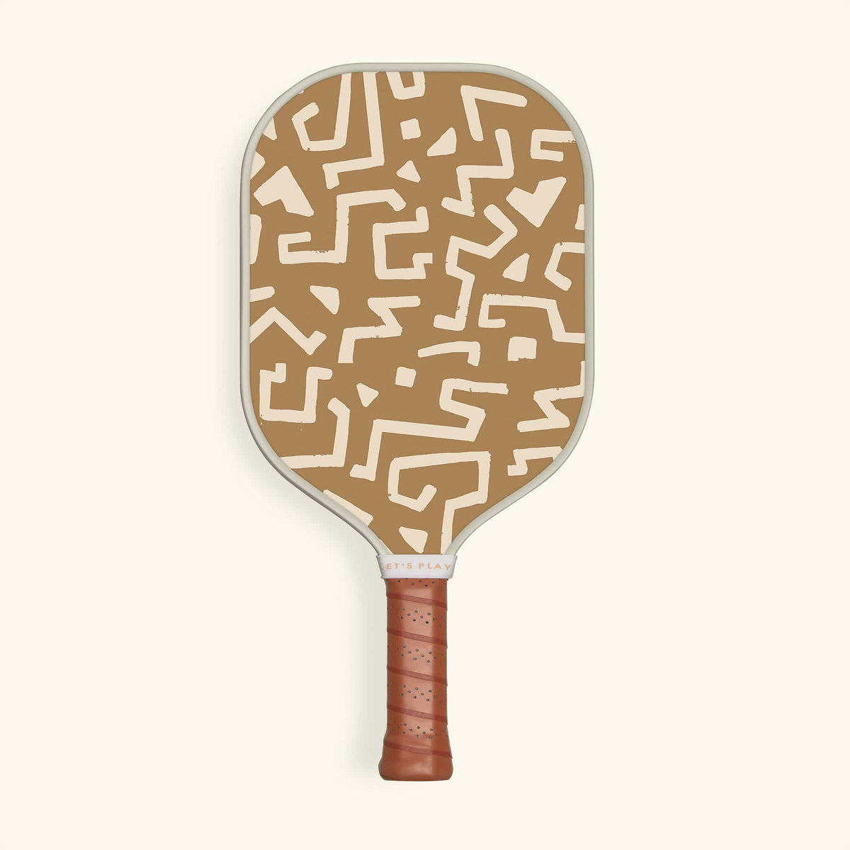 Recess Lady Bird pickleball paddle front view with tan and cream abstract geometric tribal print design and brown leather grip