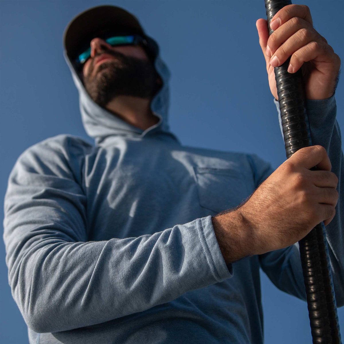 man wearing slate blue hoodie