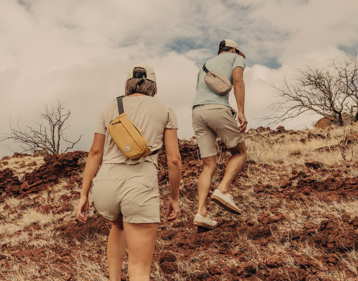 STORY man and woman hiking wearing sunski sling