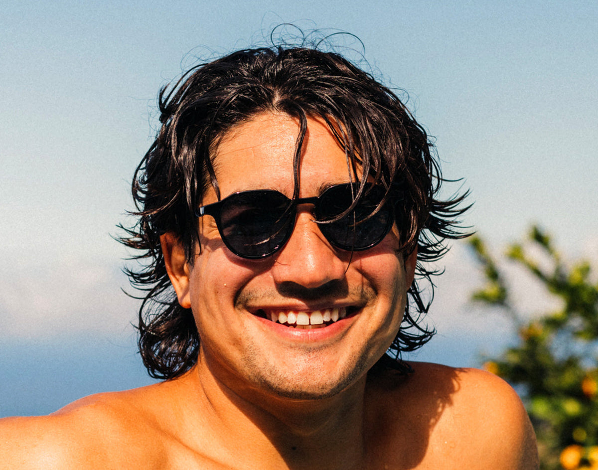 STORY guy wearing sunski vallarta sunglasses smiling
