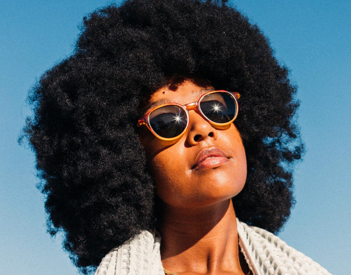 STORY girl basking wearing sunski vallarta sunglasses