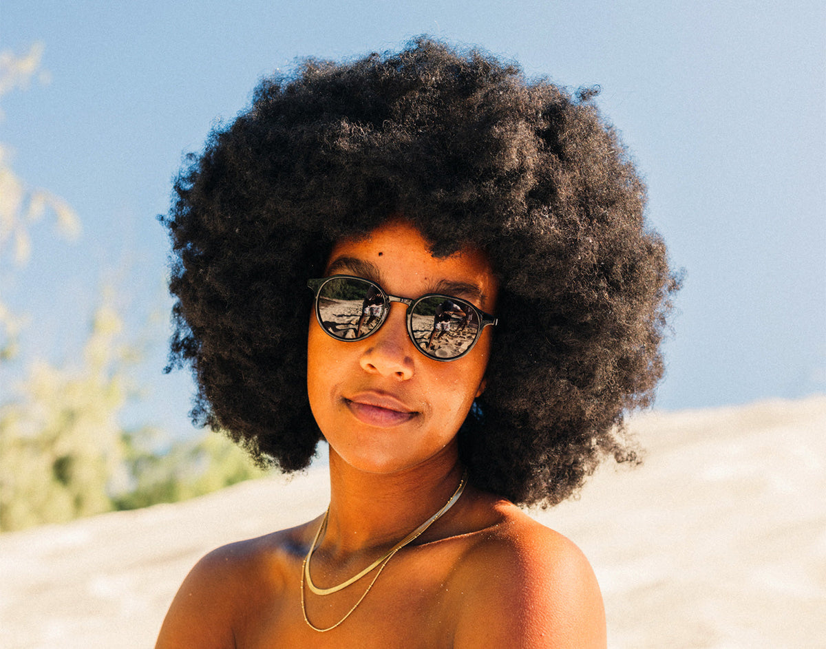 STORY girl soft smiling wearing sunski vallarta sunglasses